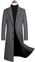 Gray overcoat on a mannequin against a white background