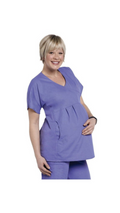 Woman wearing a purple scrub set on a white background