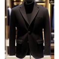 Black suit jacket on a mannequin with a blurred background
