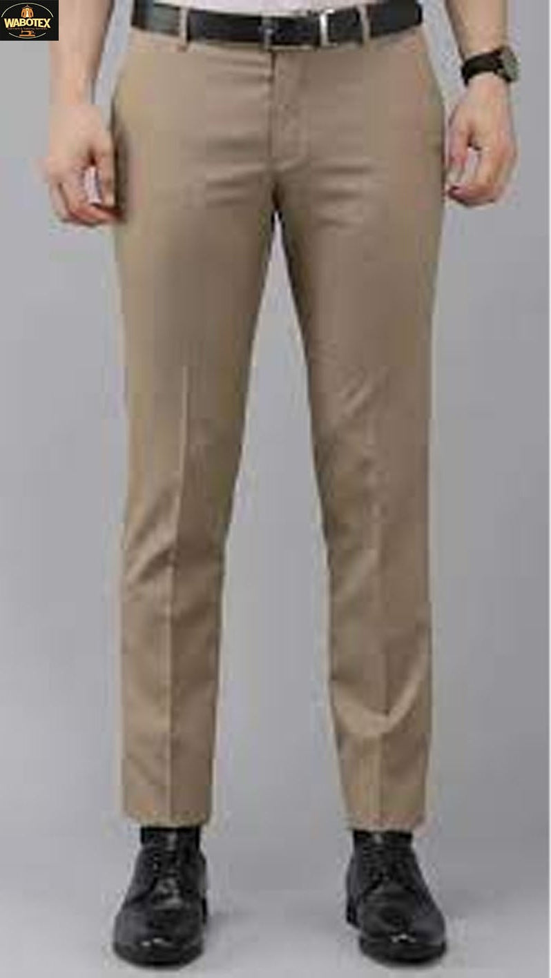 Beige pants worn by a person on a gray background