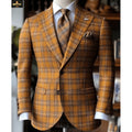 Brown plaid suit with matching tie on a mannequin against a blurred indoor background