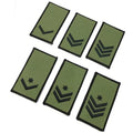 Six olive green military rank insignia patches with black borders and black embroidered chevron and star designs, arranged on a plain white background.