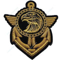 An embroidered military-style insignia patch featuring a gold eagle head and wings over an anchor motif, outlined in black on a white background.