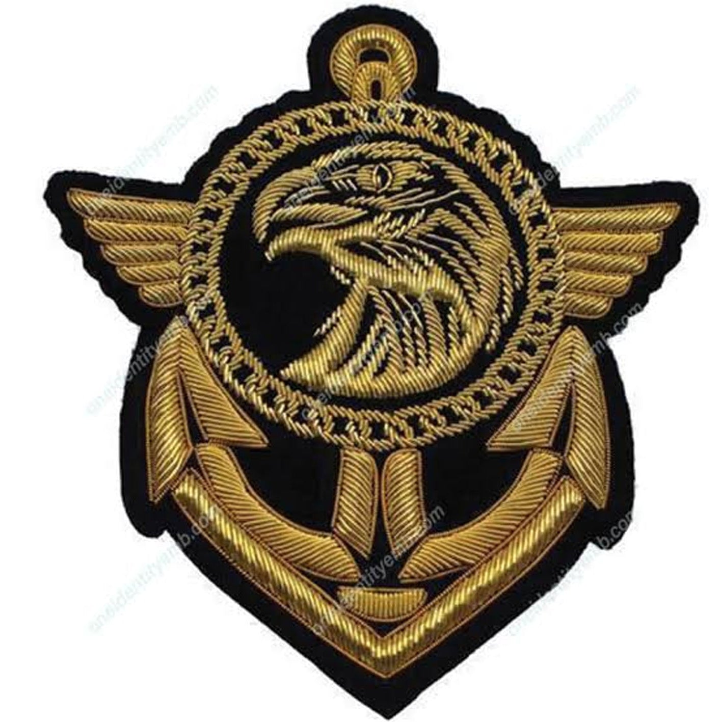 An embroidered military-style insignia patch featuring a gold eagle head and wings over an anchor motif, outlined in black on a white background.