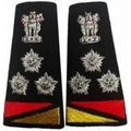 A pair of black military rank insignia patches with silver embroidered crowns and star-like emblems, plus red and gold triangular accents at the bottom, shown on a plain white background.