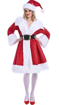 Woman wearing a Santa Claus costume on a white background