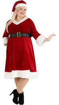Person wearing a red Santa Claus costume on a white background