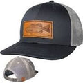 Trucker hat with leather patch featuring a fish design on a white background