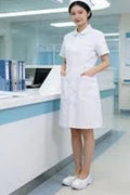 A Nurse Wearing a white pair of nurse shoes