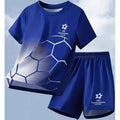 A blue soccer-themed t-shirt and shorts set with a Champions Club graphic and a soccer ball pattern gradient, shown against a light blue sky background.