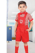 A young boy modeling a red and white checkered short-sleeve shirt with red bib overalls, red knee socks, and a red bow tie. The image features a front view of the boy, a back view inset circle, and a logo for 'ST Thomas Nur' in the top right corner.