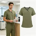 A male and female scrub vneck with olive green and vneck