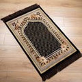 Decorative rug with intricate patterns on a wooden floor