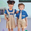 Two children in matching school uniforms standing together in a classroom setting.