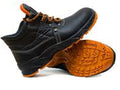 Black safety boots with orange soles on a white background