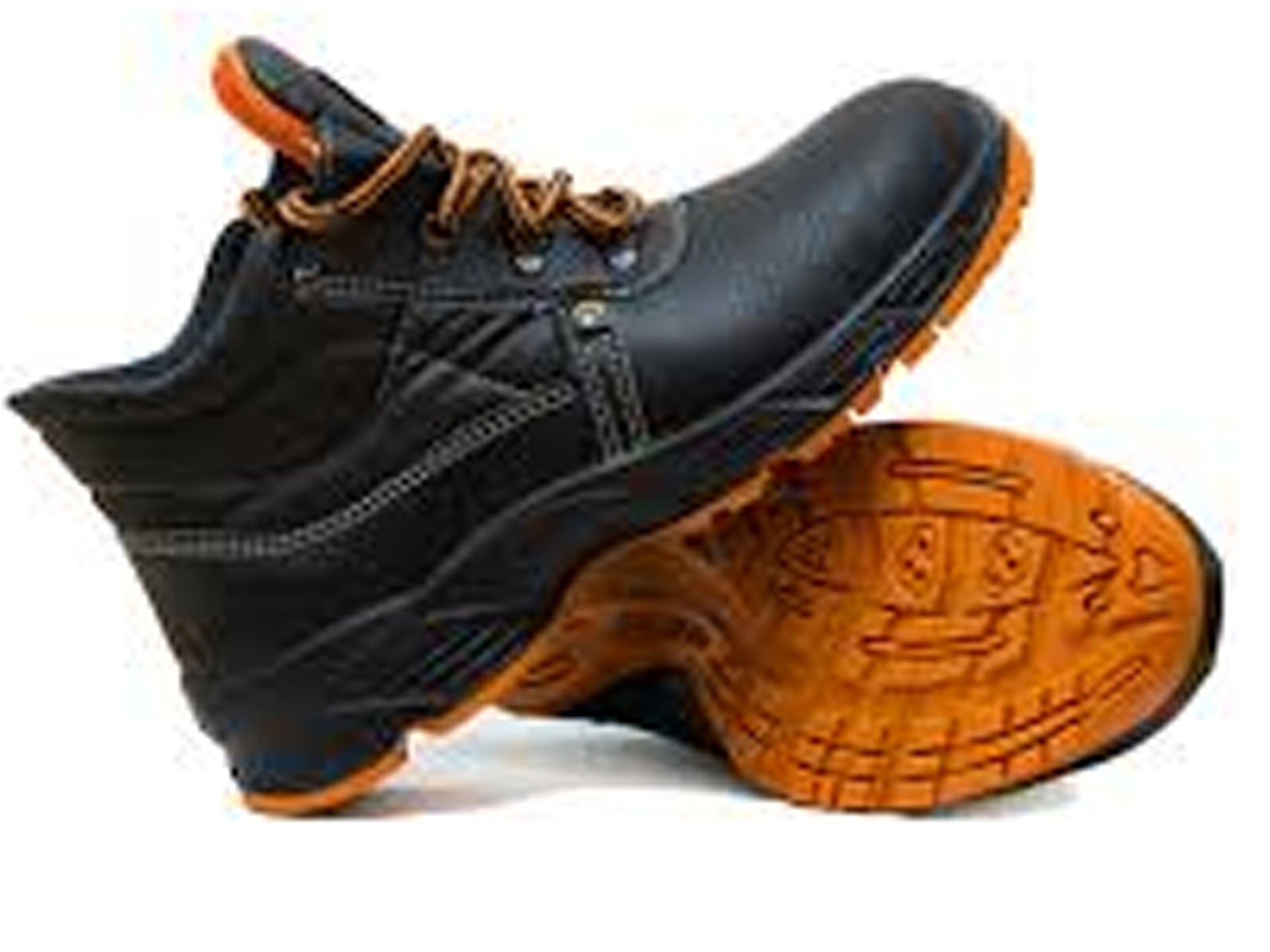 Black safety boots with orange soles on a white background