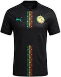 Black sports jersey with colorful patterns and a logo on a white background