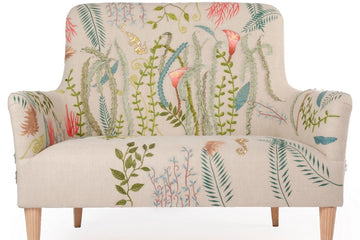 Floral-patterned armchair on a white background