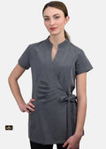 Woman wearing a gray wrap dress on a white background