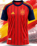 A red Spain national football team jersey with navy blue sleeves, yellow stripes on the shoulders, the Adidas logo, and the Spain crest, set against a stylized Spanish flag and stadium background.
