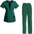 Green scrub set with top and pants on a white background