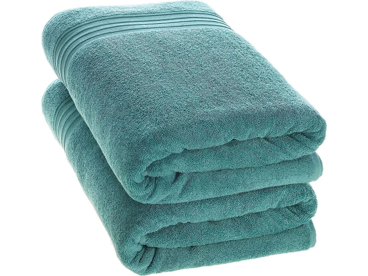 Two Torquoise Bath towels neatly folded