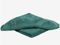 A Torqouise Bathowel neatly folded