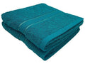 A folded torquise bath towel folded 
