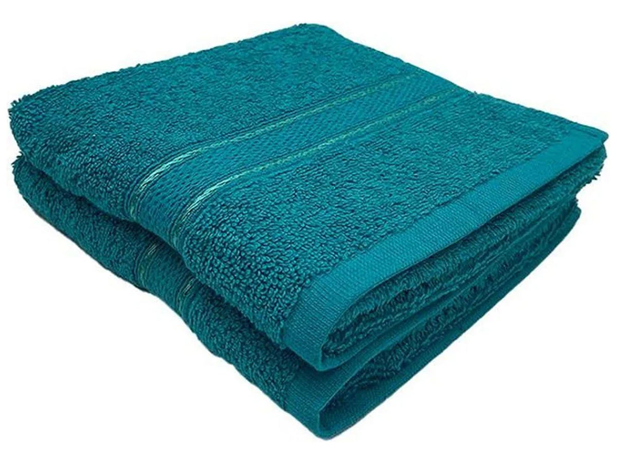 A folded torquise bath towel folded 
