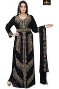 Woman wearing a black and gold embroidered dress with a matching scarf on a white background.