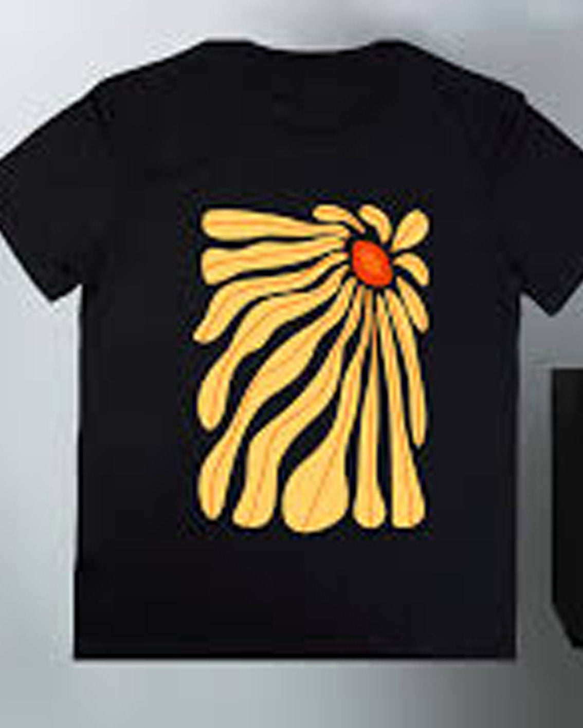 Black t-shirt with yellow floral design on a white background