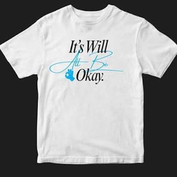 A white short-sleeve crewneck t-shirt with a printed graphic on the chest reading 'It's Will All Be Okay.' in black and light blue script, accompanied by a small blue paw print, shown against a solid black background.
