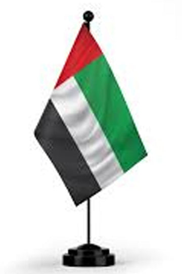 Flag of United Arab Emirates on a stand against a white background