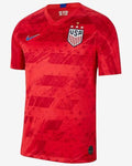 Red soccer jersey with USA and Nike logos on a white background