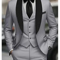 Gray suit with black lapels and bow tie on a blurred background