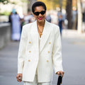 Woman Wearing white suit on a walkway