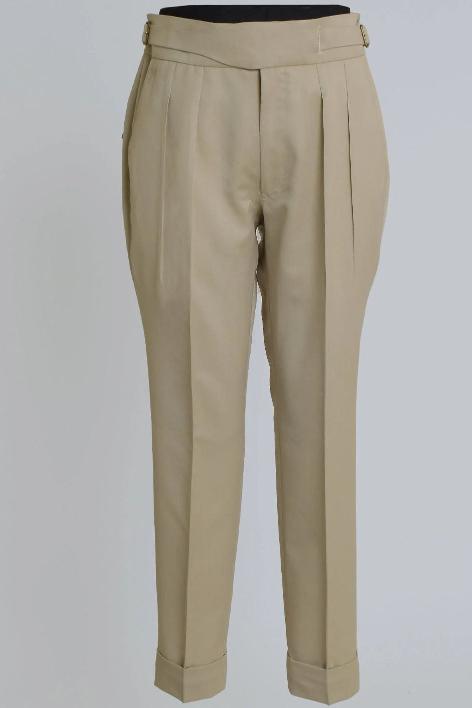 Beige pants on a light gray background