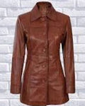 Brown leather coat on a white brick wall background