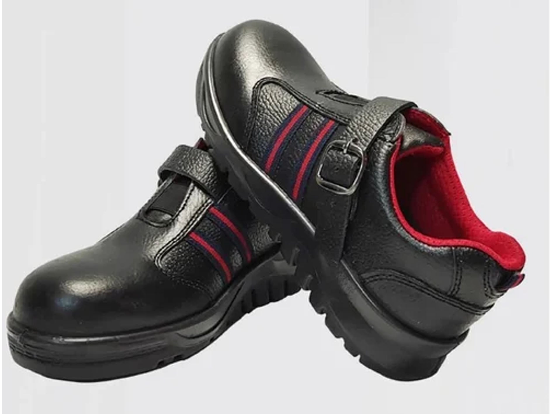 Black shoes with red accents on a light gray background