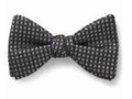 Black patterned bow tie on a white background