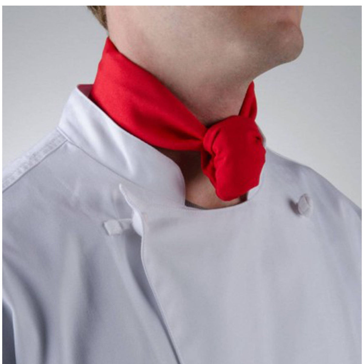 A chef wearing  tied red chef scarf