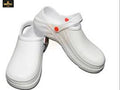 White clogs with red buttons on a white background