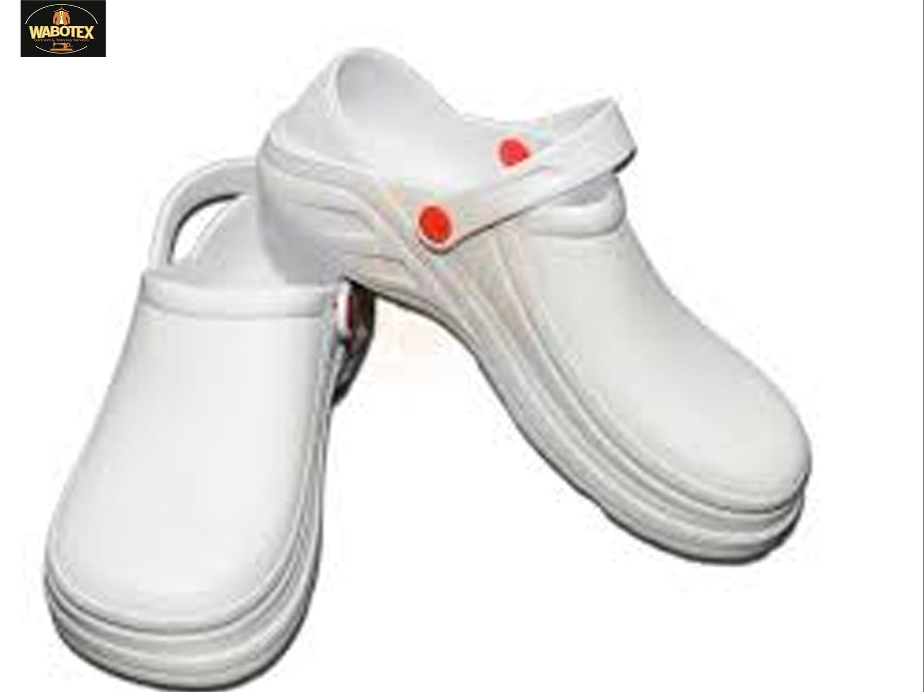 White clogs with red buttons on a white background