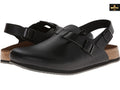 Black sandals with cork soles on a white background