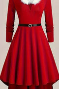 Red dress with a black belt and white fur collar on a beige background