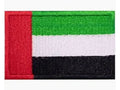 Flag patch with red, green, white, and black stripes on a white background