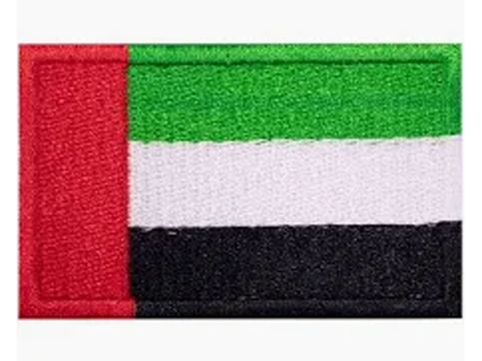 Flag patch with red, green, white, and black stripes on a white background