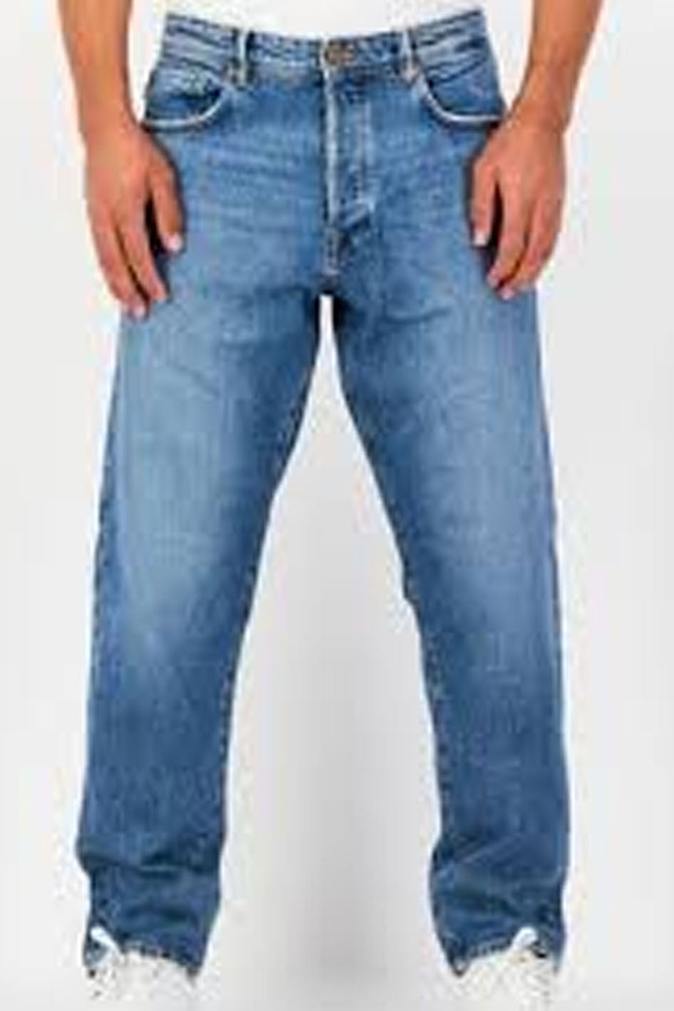 Blue jeans worn by a person on a white background
