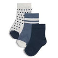Three pairs of socks with different patterns on a white background