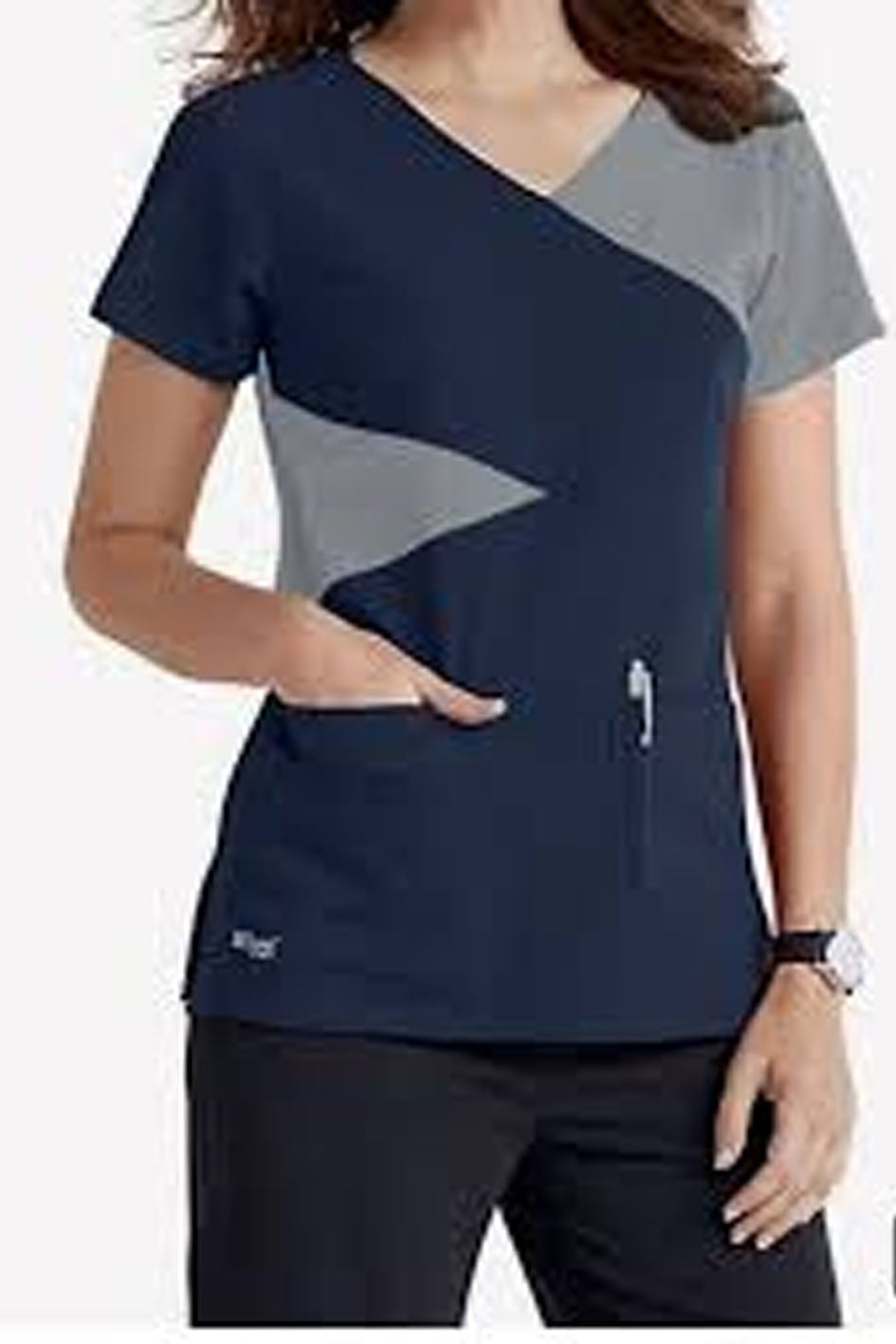 Navy blue scrub top with gray accents worn by a person on a white background